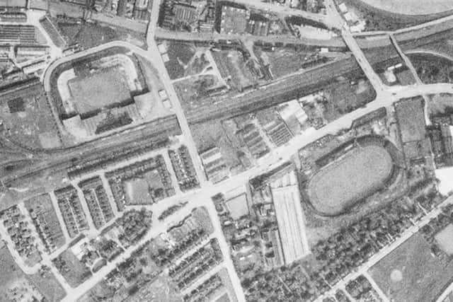 Old Trafford football ground (top) damaged during a bombing raid, taken in May 1944. (Image: Historic England)