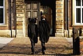 Pupils at Eton College hurry between lessons March 1, 2004 wearing the school uniform of tailcoats and starched collars, in Eton, England. (Image: Graeme Robertson/Getty Images)