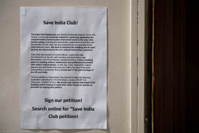 A 'save India Club' poster is pictured inside the India Club restaurant in London on October 16, 2017.