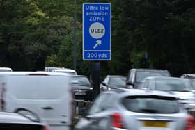 Traffic pass a sign indicating the ultra-low emission zone (ULEZ) near Hanger Lane in west London on July 22, 2023 (Getty)