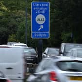 Traffic pass a sign indicating the ultra-low emission zone (ULEZ) near Hanger Lane in west London on July 22, 2023 (Getty)