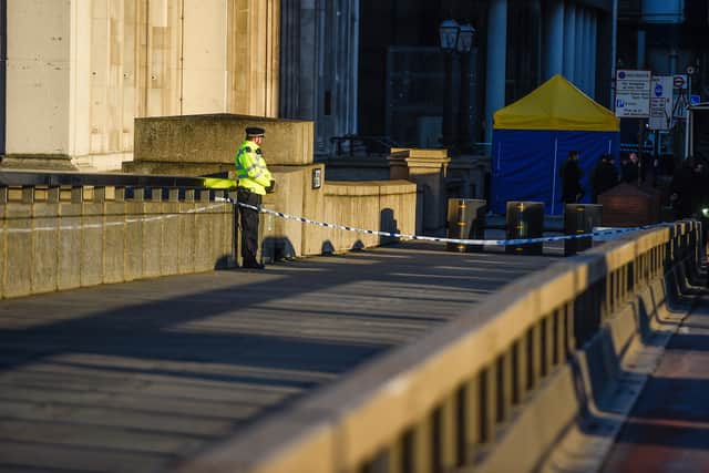 A Police officer stands next to where Usman Khan was shot, on London Bridge in December 2019 (Photo: Peter Summers/Getty Images)