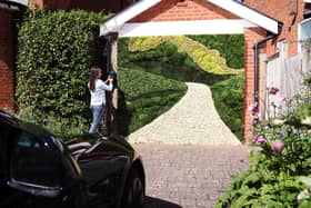 Landscape designers say with a little creativity, it is possible to balance EV charging with green front yards (Joe Pepler/PinPep/Supplied)