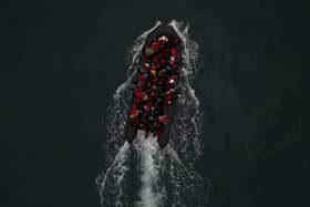 An aerial view of a boat carrying around 50 migrants. Credit: Getty Images