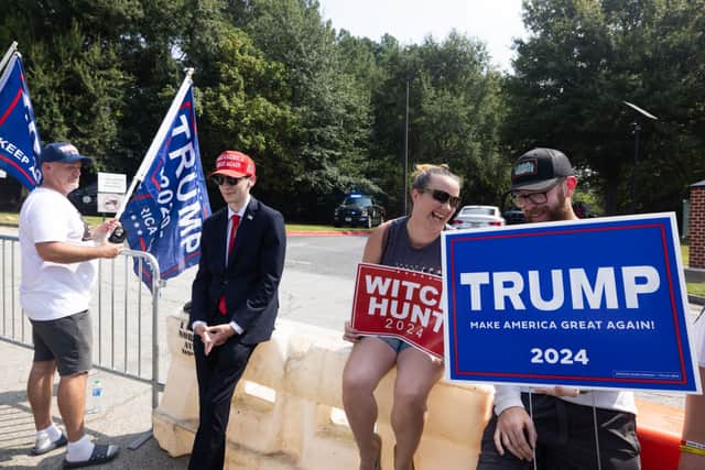 ATLANTA, GEORGIA - AUGUST 24: Supporters of former President Donald Trump gather outside of the Fulton County Jail ahead of Trump's surrender on August 24, 2023 in Atlanta, Georgia. Trump and 18 others facing felony charges in the case related to the tampering of the 2020 Election in Georgia must surrender to authorities by August 25th. (Photo by Jessica McGowan/Getty Images)