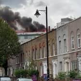 An investigation has been launched after a massive fire destroyed a mixed-use building in east London on Friday evening (25 August) (SWNS)