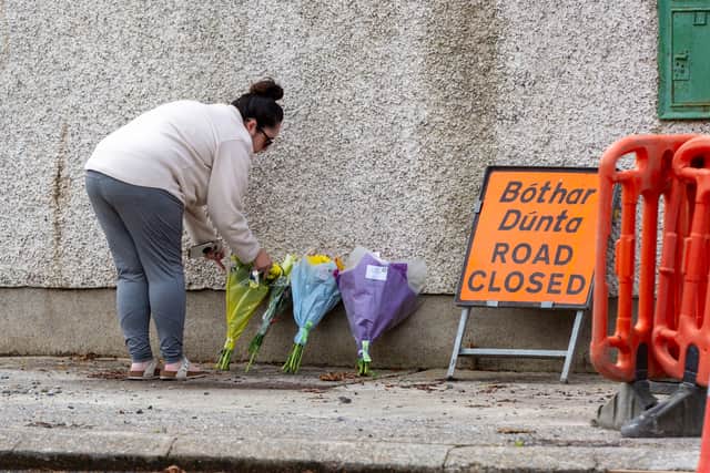 A person lays flowers near the scene of a crash which claimed the lives of four young people in Clonmel, Co Tipperary.  (Damien Storan/PA Wire)