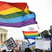 Demonstrators in favour of LGBTQ+ rights rally outside the US Supreme Court in Washington, DC, October 8, 2019, as the court holds oral arguments in three cases dealing with workplace discrimination based on sexual orientation. (Photo by SAUL LOEB / AFP) (Photo by SAUL LOEB/AFP via Getty Images)