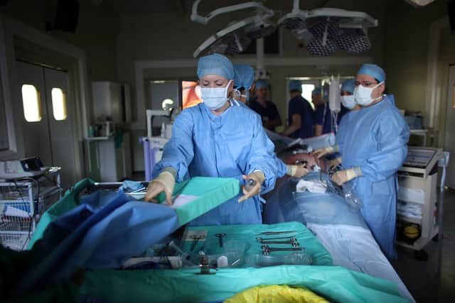 A team of surgeons perform key hole surgery to remove a gallbladder at The Queen Elizabeth Hospital on March 16, 2010 in Birmingham, England. Credit: Getty Images
