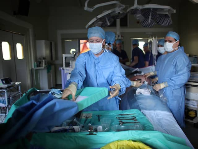 A team of surgeons perform key hole surgery to remove a gallbladder at The Queen Elizabeth Hospital on March 16, 2010 in Birmingham, England. Credit: Getty Images