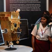 Students look at a model of Aditya-L1 spacecraft ahead of its launch, in a science and technology museum in Kolkata on September 2, 2023. (Image: DIBYANGSHU SARKAR/AFP via Getty Images)