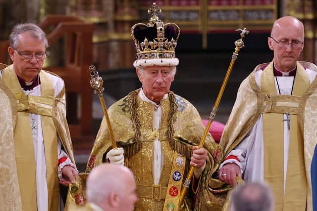 King Charles III stands after being crowned during his coronation ceremony in Westminster Abbey, on May 6, 2023 in London, England. (Photo by Richard Pohle - WPA Pool/Getty Images)