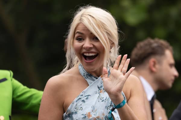 LONDON, UNITED KINGDOM  - JUNE 05: Holly Willoughby rides a bus along the Mall during the Platinum Pageant on June 05, 2022 in London, England, celebrating a vibrant display of British life since 1972" The Platinum Jubilee of Elizabeth II is being celebrated from June 2 to June 5, 2022, in the UK and Commonwealth to mark the 70th anniversary of the accession of Queen Elizabeth II on 6 February 1952.  (Photo by Dan Kitwood/Getty Images)
