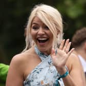 LONDON, UNITED KINGDOM  - JUNE 05: Holly Willoughby rides a bus along the Mall during the Platinum Pageant on June 05, 2022 in London, England, celebrating a vibrant display of British life since 1972" The Platinum Jubilee of Elizabeth II is being celebrated from June 2 to June 5, 2022, in the UK and Commonwealth to mark the 70th anniversary of the accession of Queen Elizabeth II on 6 February 1952.  (Photo by Dan Kitwood/Getty Images)
