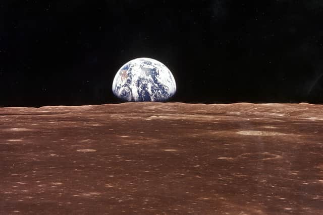  A view of the Earth appears over the Lunar horizon (Image: NASA/Newsmakers)