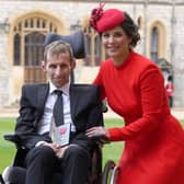 Former rugby league player Rob Burrow and his wife Lindsey pose for a photograph with his medal after Rob is appointed a Member of the Order of the British Empire (MBE) at an investiture ceremony at Windsor Castle, on April 5, 2022. (Photo by Steve Parsons / POOL / AFP) (Photo by STEVE PARSONS/POOL/AFP via Getty Images)