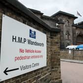 LONDON, ENGLAND - MAY 18:  Two women walk out of the entrance to Wandsworth Prison on May 18, 2016 in London, England. HM Prison Wandsworth is a Category B men's prison and is the largest prison in the United Kingdom.  (Photo by Chris Ratcliffe/Getty Images)