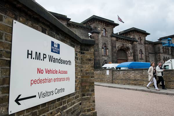 LONDON, ENGLAND - MAY 18:  Two women walk out of the entrance to Wandsworth Prison on May 18, 2016 in London, England. HM Prison Wandsworth is a Category B men's prison and is the largest prison in the United Kingdom.  (Photo by Chris Ratcliffe/Getty Images)