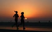 Runners jog along Kite Beach (Image: Warren Little/Getty Images)
