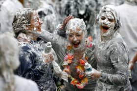 Students from St Andrews University indulge in a tradition of covering themselves with foam to honour the 'academic family' (Photo: Jeff J Mitchell/Getty Images)