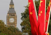 Chinese flags outside Big Ben in 2005 (Photo: JOHN D MCHUGH/AFP via Getty Images)