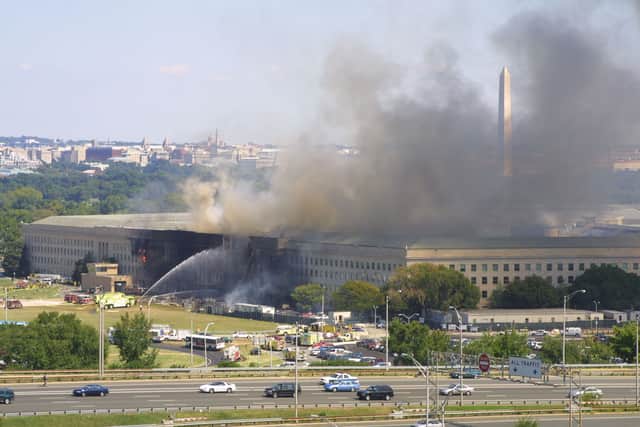 Smoke comes out from the west wing of the Pentagon building September 11, 2001 in Arlington, Va., after a plane crashed into the building and set off a huge explosion. (Photo by Alex Wong/Getty Images)