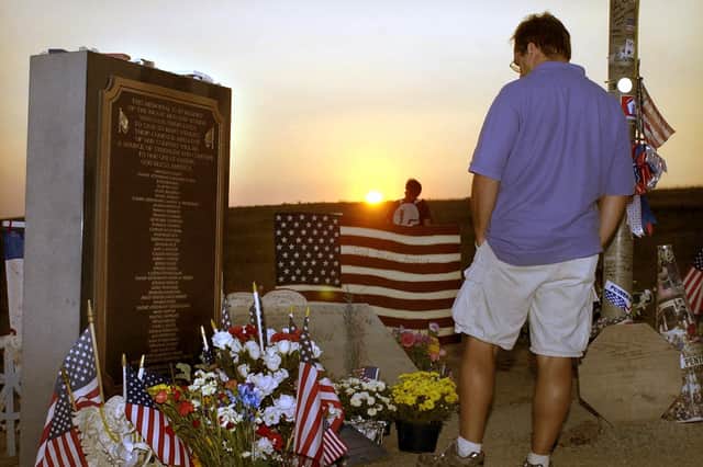 Visitors view the memorial to the victims of the hijacked Flight 93 at sunset on 10 September 2002 in Shanksville, PA. (Photo credit should read DAVID MAXWELL/AFP via Getty Images)