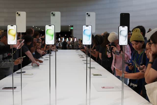 Attendees look at brand new Apple products during an Apple event at the Steve Jobs Theater at Apple Park on September 12, 2023 in Cupertino, California.(Photo by Justin Sullivan/Getty Images)