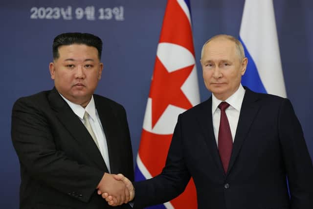 This pool image distributed by Sputnik agency shows Russian President Vladimir Putin and North Korea’s leader Kim Jong Un shaking hands during their meeting at the Vostochny Cosmodrome on 13 September, 2023, ahead of planned talks that could lead to a weapons deal with Russian President. Credit: Photo by VLADIMIR SMIRNOV/POOL/AFP via Getty Images