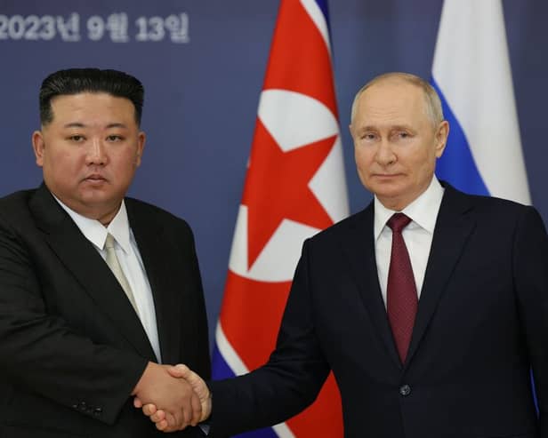 This pool image distributed by Sputnik agency shows Russian President Vladimir Putin and North Korea’s leader Kim Jong Un shaking hands during their meeting at the Vostochny Cosmodrome on 13 September, 2023, ahead of planned talks that could lead to a weapons deal with Russian President. Credit: Photo by VLADIMIR SMIRNOV/POOL/AFP via Getty Images