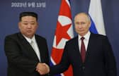 This pool image distributed by Sputnik agency shows Russian President Vladimir Putin and North Korea’s leader Kim Jong Un shaking hands during their meeting at the Vostochny Cosmodrome on 13 September, 2023, ahead of planned talks that could lead to a weapons deal with Russian President. Credit: Photo by VLADIMIR SMIRNOV/POOL/AFP via Getty Images