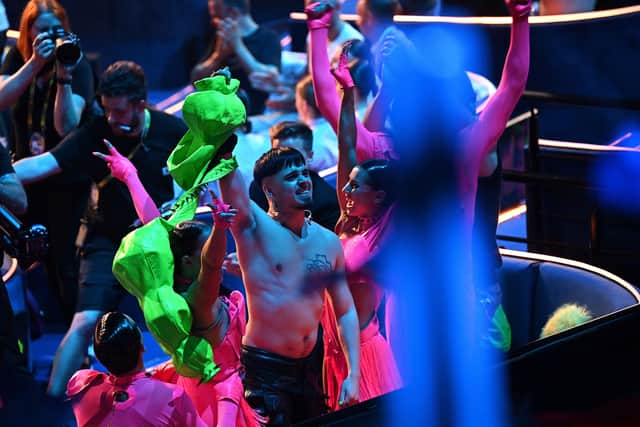 Rapper Kaarija representing Finland celebrate the results after the first semi-final of the 2023 Eurovision Song contest at the M&S Bank Arena in Liverpool, northern England, on May 9, 2023. (Photo by PAUL ELLIS/AFP via Getty Images)