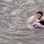 Heroic bystander jumped into a fast-flowing river to rescue a young girl in China