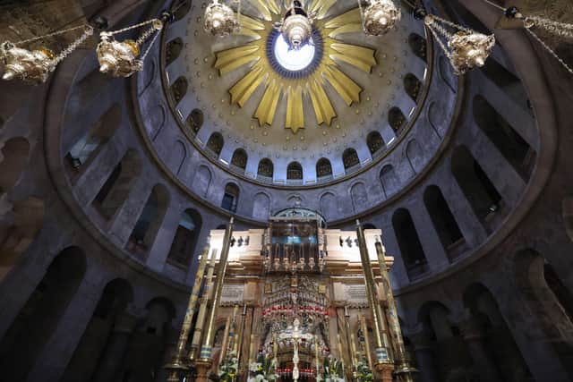 Light seeping from the dome oculus hits the altar, set up in front of the Edicule, traditionally believed to be the burial site of Jesus Christ, prior to mass on Easter Sunday at the Church of the Holy Sepulchre in Jerusalem on April 4, 2021. (Photo by Emmanuel DUNAND / AFP) (Photo by EMMANUEL DUNAND/AFP via Getty Images)