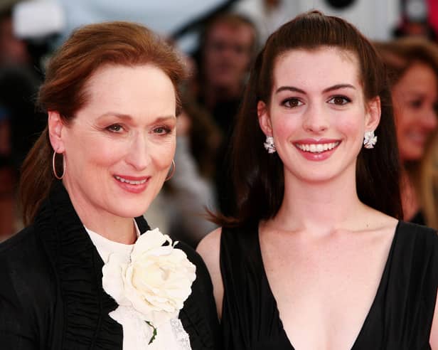 Actresses Meryl Streep (L) and Anne Hathaway were the stars of the Devil Wears Prada film. They are pictured at the premiere in 2006. The story has now been turned into a musical. Photo by Getty Images.