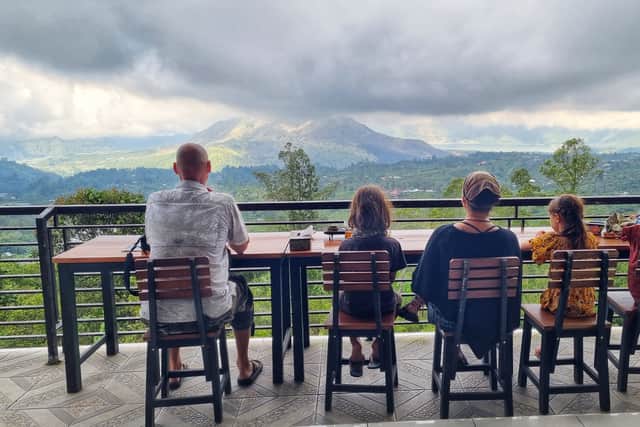 The family take in the view at mount Batur, Bali.