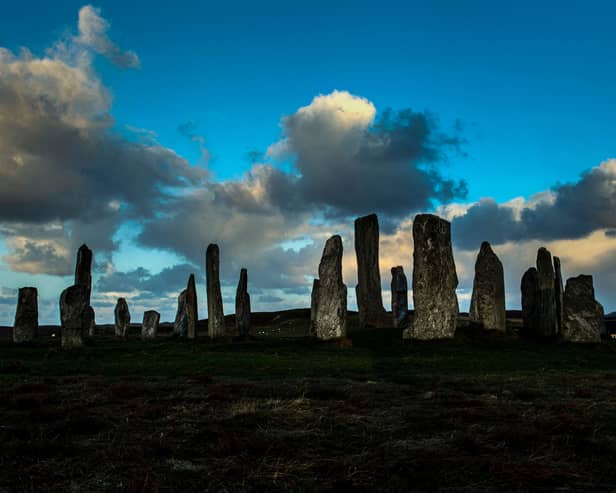 The Calanais Standing Stones are seen in the early morning light on the Isle Of Lewis, off the north-west coast of the Scottish mainland on November 24, 2021. (Photo by ANDY BUCHANAN/AFP via Getty Images)