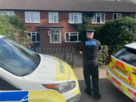 A police officer outside a property in Main Street, Stonnall, Staffordshire, after a man died after being bitten by two dogs. 