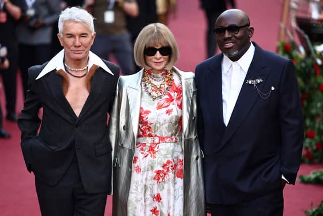 Australian film director Baz Luhrmann, Vogue editor-in-chief Anna Wintour and British Vogue editor-in-chief Edward Enninful pose upon arrival to attend the "Vogue World: London" event at the Theatre Royal Drury Lane in central London on the eve of London Fashion Week on September 14, 2023. (Photo by HENRY NICHOLLS / AFP) (Photo by HENRY NICHOLLS/AFP via Getty Images)