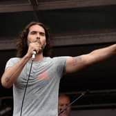LONDON, ENGLAND - JUNE 20:  Comedian Russell Brand speaks to thousands of demonstrators gathered in Parliament Square to protest against austerity and spending cuts on June 20, 2015 in London, England. Thousands of people gathered to march from the City of London to Westminster, where they listened to addresses from singer Charlotte Church and comedian Russell Brand as well as Len McCluskey, general secretary of Unite and Sinn Fein's Martin McGuinness.  (Photo by Mary Turner/Getty Images)