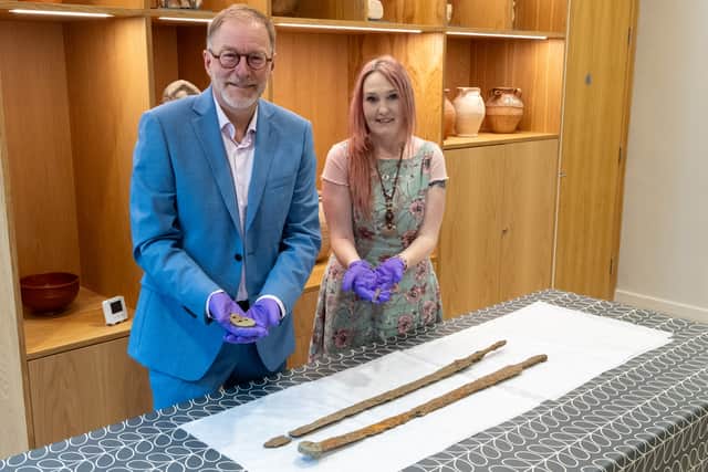 Cllr Paul Hodgkinson, Cotswold District Council Cabinet Member for Leisure, Culture and Health and Emma Stuart, Corinium Museum Director with the Roman Cavalry Swords. (SWNS)