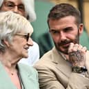 Former British football player David Beckham and his mother Sandra Beckham sit in the royal box in Center Court during the women's singles tennis match between Russia's Daria Kasatkina and Britain's Jodie Burrage on the third day of the 2023 Wimbledon Championships at The All England Tennis Club in Wimbledon, southwest London, on July 5, 2023. (Photo by SEBASTIEN BOZON / AFP) / RESTRICTED TO EDITORIAL USE (Photo by SEBASTIEN BOZON/AFP via Getty Images)