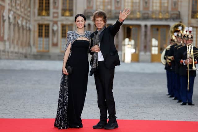 English singer Mick Jagger and his partner US choreographer Melanie Hamrick arrive to attend a state banquet at the Palace of Versailles, west of Paris, on September 20, 2023, on the first day of a British royal state visit to France. Britain's King Charles III and his wife Queen Camilla are on a three-day state visit to France. (Photo by Ludovic MARIN / AFP) (Photo by LUDOVIC MARIN/AFP via Getty Images)