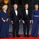 (From L) Britain's Queen Camilla, Britain's King Charles III, French President Emmanuel Macron and French president's wife Brigitte Macron arrive to attend a state banquet at the Palace of Versailles, west of Paris, on September 20, 2023, on the first day of a British royal state visit to France. Britain's King Charles III and his wife Queen Camilla are on a three-day state visit to France. (Photo by Ludovic MARIN / AFP) (Photo by LUDOVIC MARIN/AFP via Getty Images)