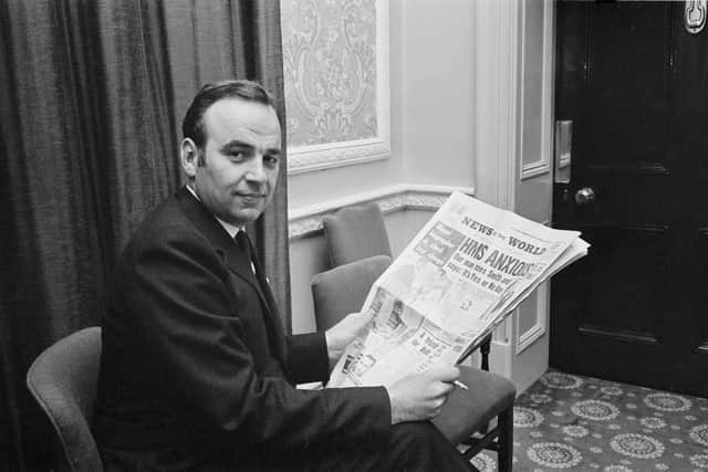 Australian media mogul Rupert Murdoch holding a copy of his News Of The World newspaper during a press conference in London, 25th October 1968. (Photo by Stan Meagher/Daily Express/Hulton Archive/Getty Images)