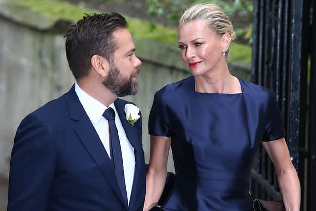 Lachlan Murdoch (L) and his wife Sarah arrive at St Bride's church on Fleet Street in central London on March 5, 2016, to attend a ceremony of celebration a day after the official marriage of Australian born media magnate  Rupert Murdoch to Jerry Hall. (Photo by JUSTIN TALLIS/AFP via Getty Images)
