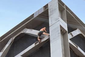 A man has been arrested after a free-climber was spotted scaling the 'Cheesegrater' building in London