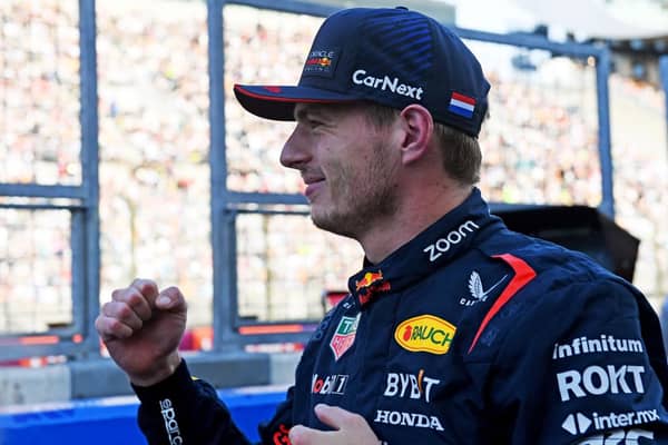 TOPSHOT - Red Bull Racing's Dutch driver Max Verstappen celebrates taking the pole position after  the qualifying session for the Formula One Japanese Grand Prix at the Suzuka circuit, Mie prefecture on September 23, 2023. (Photo by Toshifumi KITAMURA / AFP) (Photo by TOSHIFUMI KITAMURA/AFP via Getty Images)