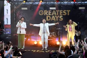  Take That (L-R) Howard Donald, Gary Barlow and Mark Owen perform on stage during Take That's "Greatest Days" World Premiere at the Odeon Luxe Leicester Square on June 15, 2023 in London, England. (Photo by Gareth Cattermole/Getty Images)