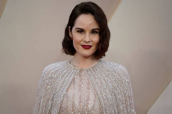 British actor Michelle Dockery poses on the red carpet upon arrival for the world premiere of the film "Downton Abbey: A New Era" in London on April 25, 2022. (Photo by Niklas HALLE'N / AFP) 